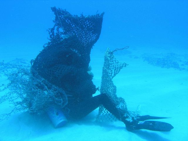 As part of Marine Removal Debris Diver training, Joel Paschal is entangled in the dreaded 