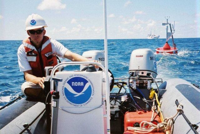 A CREWS buoy is towed from NOAA ship TOWNSEND CROMWELL for deployment in shallow water. Picture