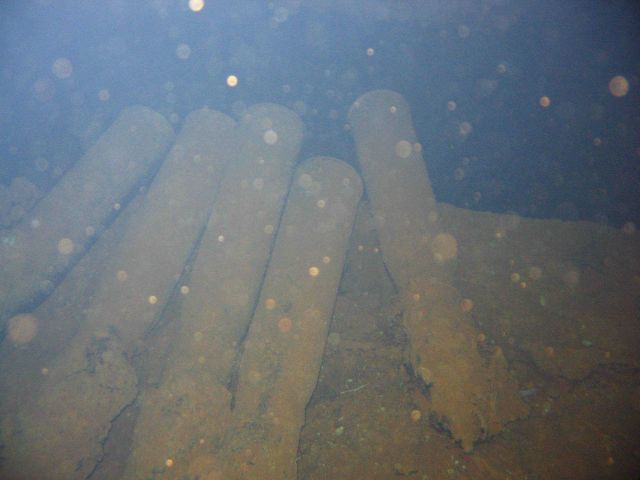 Torpedoes strewn about the hold of the Heian Maru, a submarine tender. Picture