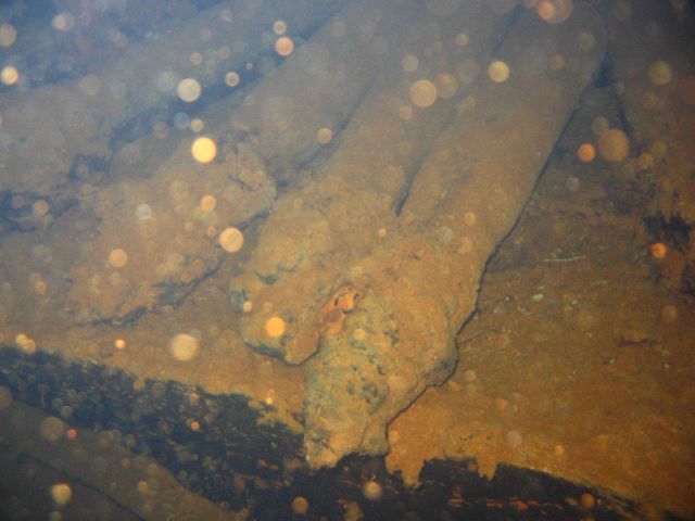 Torpedoes strewn about the hold of the Heian Maru, a submarine tender. Picture