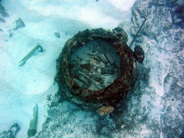 Looking down into a blubber rendering pots from the wreck of an early Nineteenth Century whaling vessel on Pearl and Hermes Reef. Picture