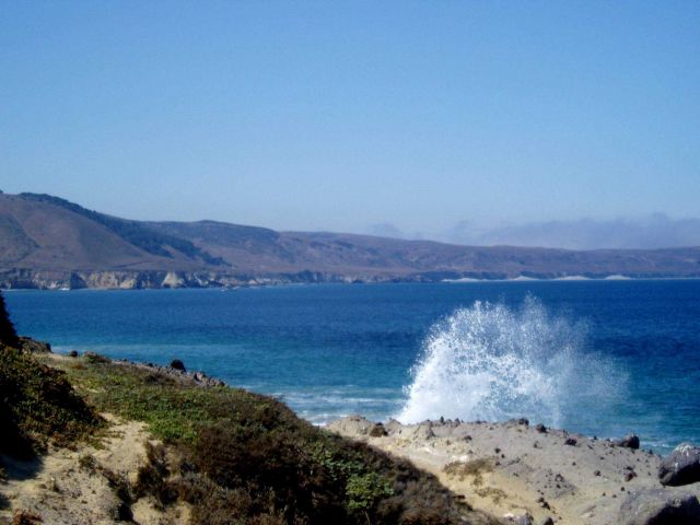 Waves crashing into Santa Rosa Island produce an arc of spray. Picture