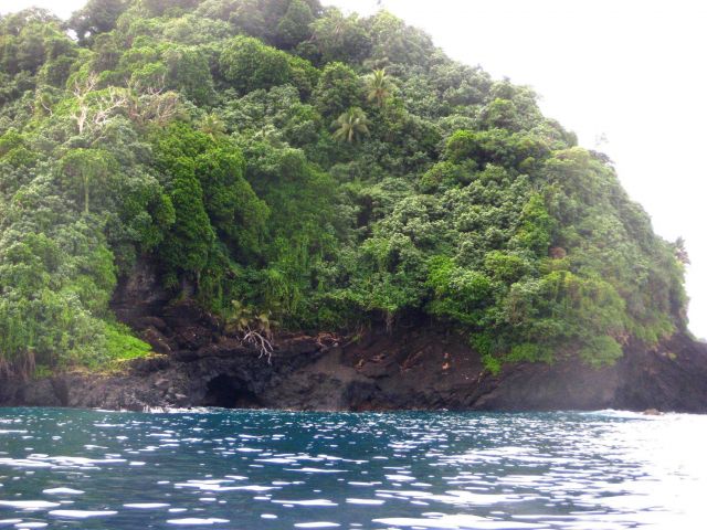 A sea cave or lava tube on the volcanic shores of American Samoa. Picture
