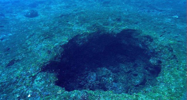 Excavation pit left by treasure hunters searching for the supposed wreck of a Spanish galleon on Bright Bank. Picture