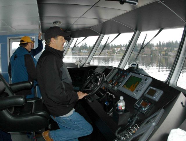 Captain Chuck Curry at the helm of the R/V MANTA during shakedown operations near Bellingham, Washington. Picture