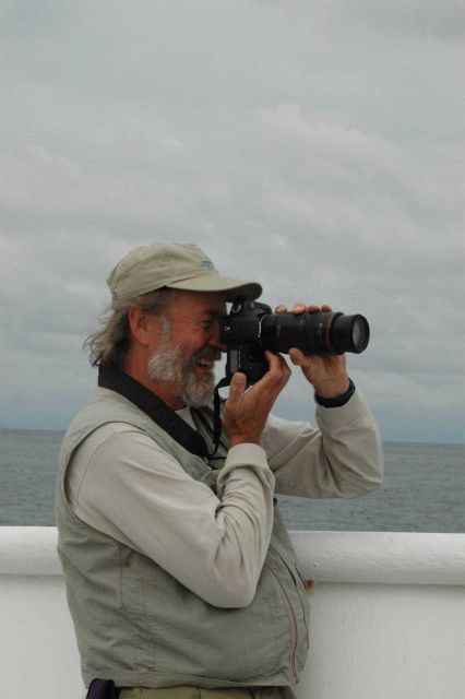 Ed Bowlby, Research Coordinator for the Olympic Coast National Marine Sanctuary, photographing humpback whales feeding just off the bow of the NOAA Sh Picture