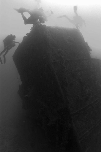 Divers on the bow of the NORTHERN LIGHT at nearly 190 feet water depth. Picture