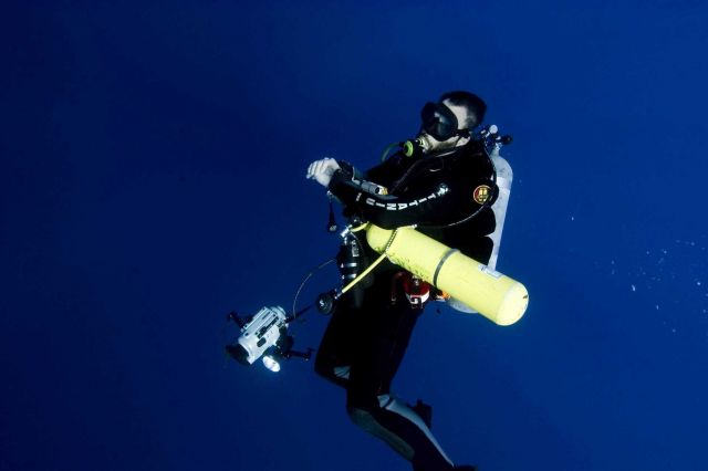 Diving archaeologist descending to the remains of the NORTHERN LIGHT. Picture