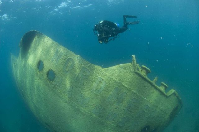 A diver photographing the German freighter NORDMEER that met its end on Lake Superior. Picture