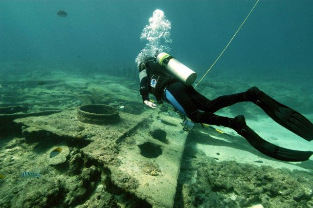 Archaeologist studying the DUNNOTTAR CASTLE wreckage. Picture