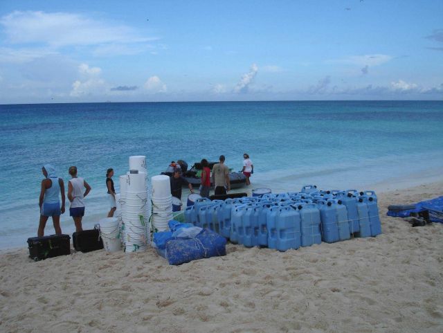 Returning empty containers from a shore camp. Picture