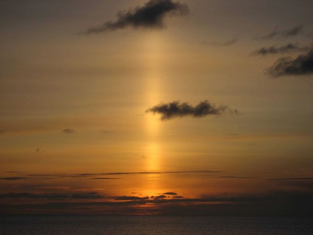 A sun pillar following the setting of the sun. Picture