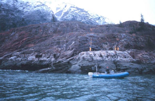 The Tide Gauge Team installing a tide gauge in the icy waters of Tracy Arm Picture