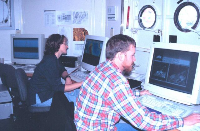 Assistant Survey Tech Scott Warrender and Survey Tech Sandy Zirnfield processing multi-beam data in the Holodeck Picture