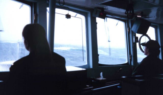 Ensigns Angie Messer and Angie Venturato keep a sharp lookout during a storm in the Gulf of Alaska. Picture