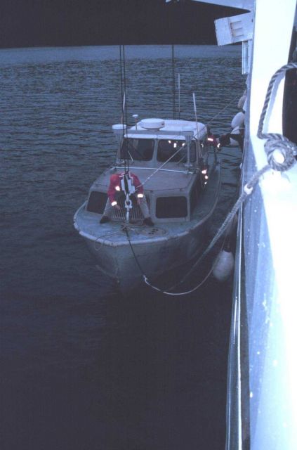 Senior Survey Tech Paul McAnally secures the bow hook on RA-1 prior to hoisting boat out of water. Picture