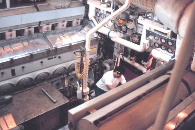 2nd Engineer Bill Ness at work in the RAINIER's engine room. Picture