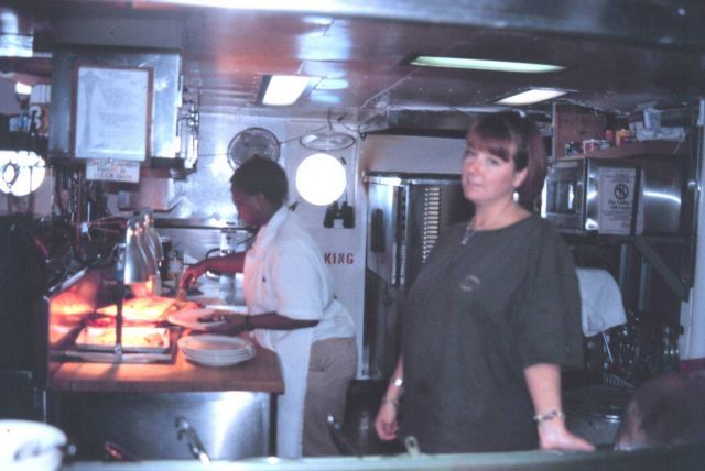 Chief Cook Doretha and 2nd Cook Sarah Satterfield prepare another fine meal in the ship's galley. Picture