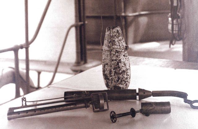 Deep-sea sounding lead, thermometer, and water bottle. Picture