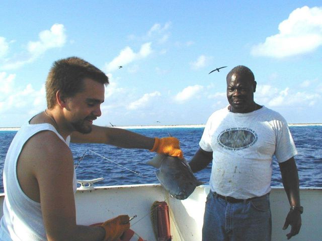Deck hand Mike Theberge and seaman surveyor Leroy Johnson with fish caught off Clipperton Island during STAR 2000. Picture