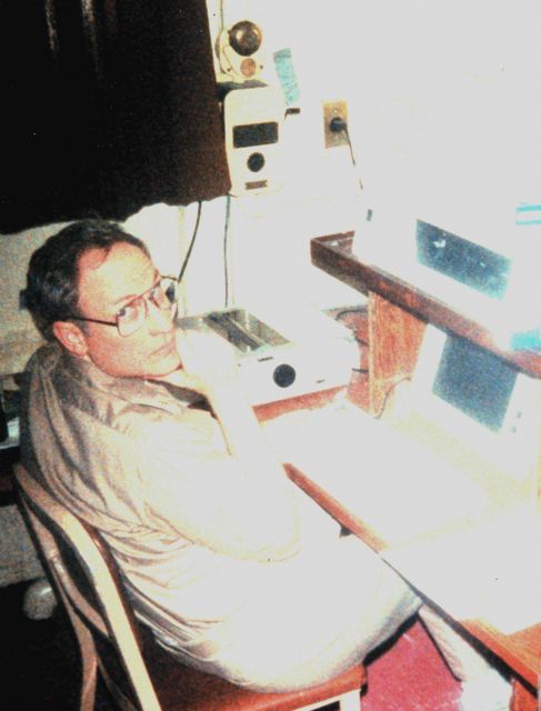 Commander Ron Jones, Operations Officer on NOAA Ship SURVEYOR, considering next day's work while conducting multi-beam sounding operations north of Sa Picture