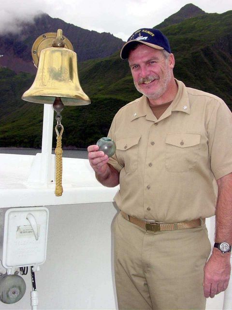 Captain John Humphrey with a newly found prized glass net float - Fish Hook Bay Picture