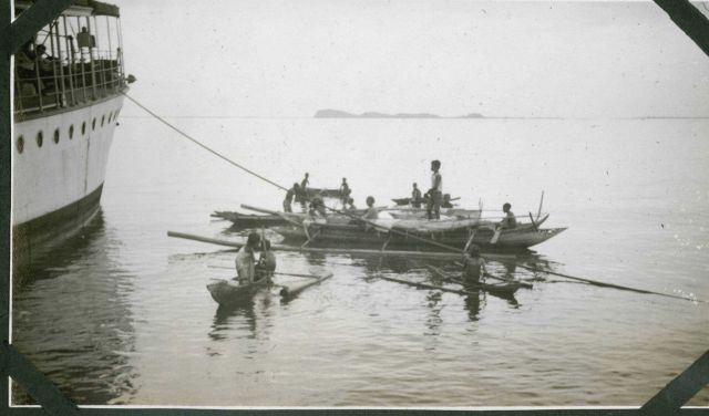 Diving for coins and peddling wares to the FATHOMER. Picture