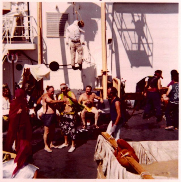 King Neptune and his court planning for the arrival of the disgusting pollywogs. Picture