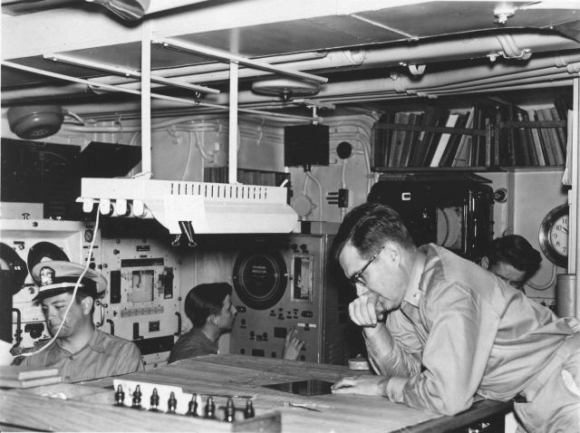 Cogitating over a hydrographic boat sheet on board the Coast and Geodetic Survey Ship EXPLORER Picture
