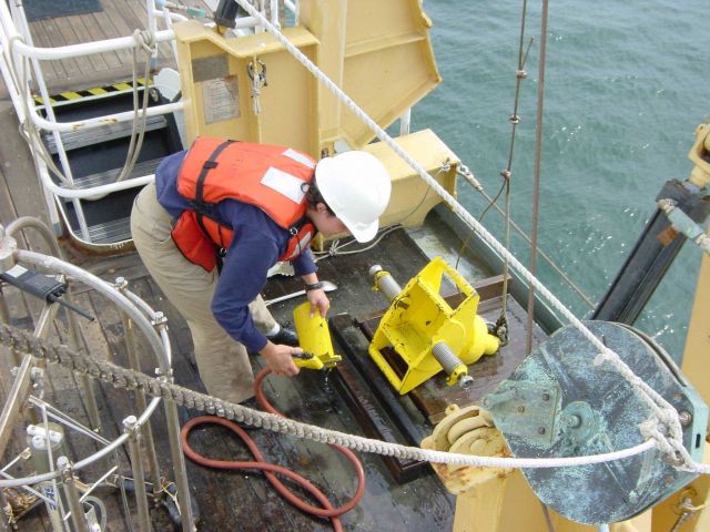 Cleaning bottom sampling device after deployment on the NOAA Ship WHITING. Picture