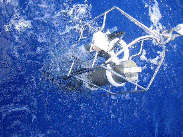 CTD equipment is being pulled up manually off the Mexican ship BIP during a coastal oceanographic cruise off the waters of Xcalak between NOAA and ECO Picture