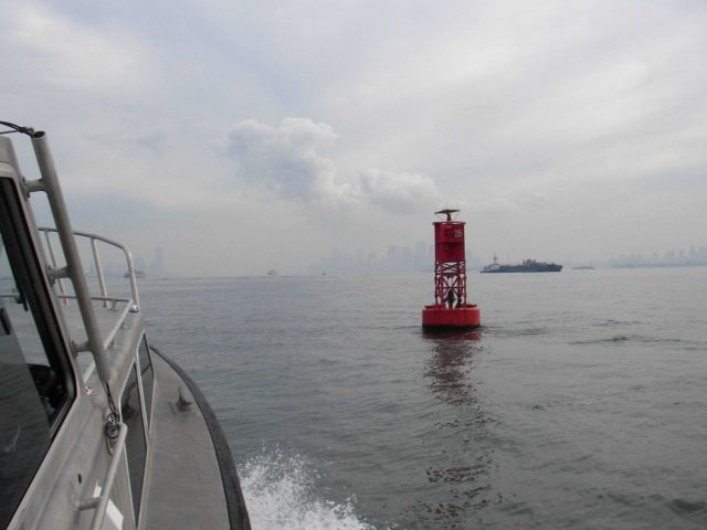 Survey launch off NOAA Ship THOMAS JEFFERSON underway in New York Harbor with Manhattan ahead. Picture