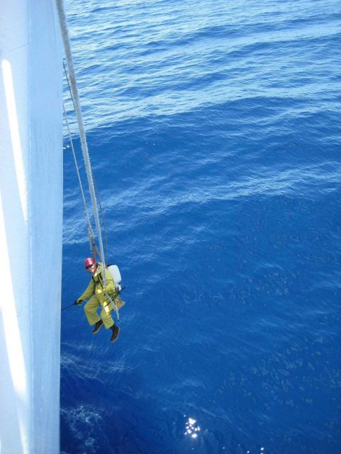 Touching up the bow of the NOAA Ship HI'IALAKAI Picture