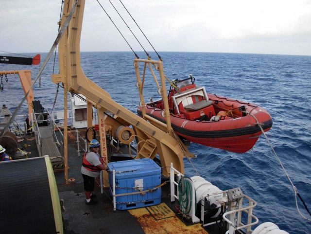 Preparing to launch rigid hull inflatable boat (RHIB) off of NOAA Ship KA'IMIMOANA (R333) Picture