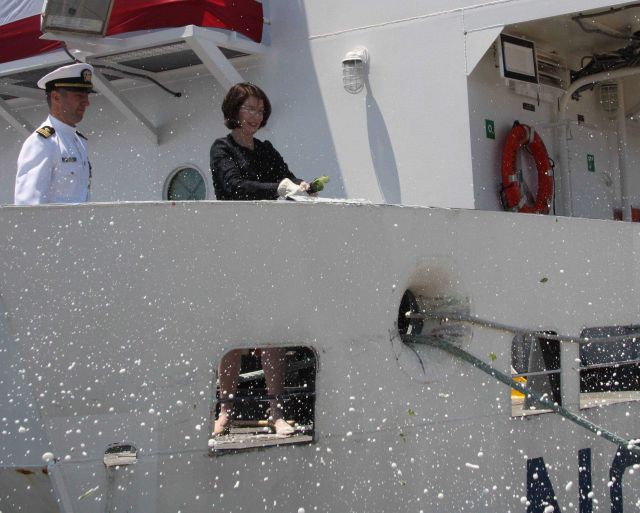 Commanding officer-select, Lieutenant Commander Ben Evans, observes as Catherine Sununu christens the NOAA Ship FERDINAND R Picture