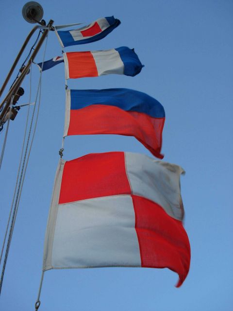 Call letter flags entering port - Whiskey Tango Echo Uniform of NOAA Ship KA'IMIMOANA. Picture