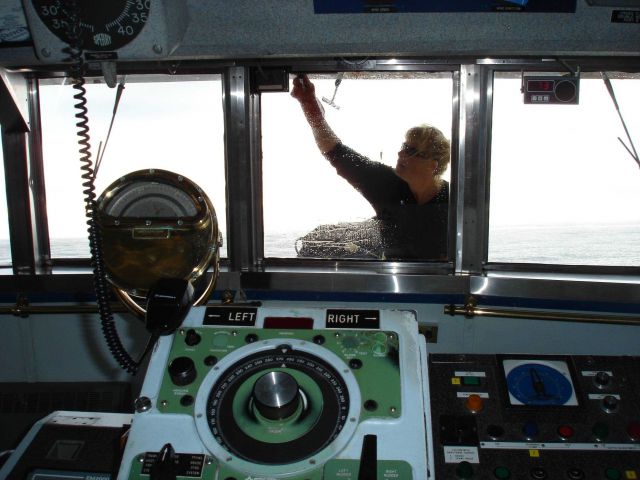 Washing windows after the storm - remove salt spray for better visibility. Picture