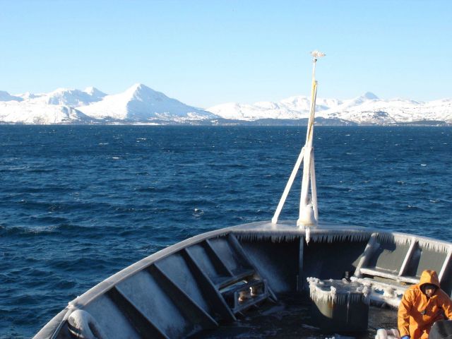 Removing ice after getting in the lee of land. Picture