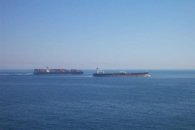 A containership and tanker outbound in the Straits of Gibraltar. Picture