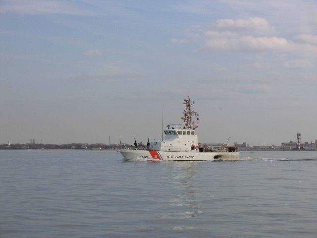 Coast Guard Cutter BELUGA patrolling Navy base area of Norfolk. Picture