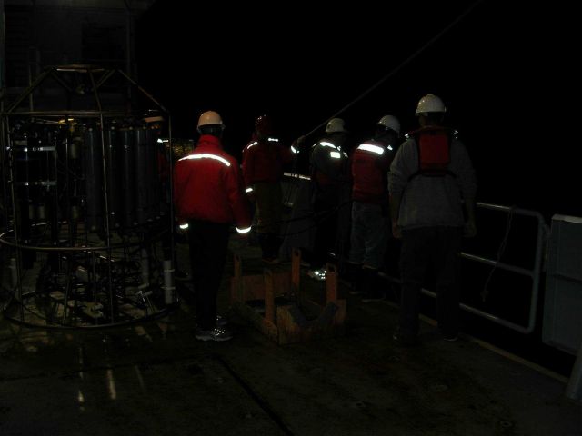 Camera flash reflecting off PFDs during deployment of towed acoustic multibeam array aboard R/V THOMAS G Picture