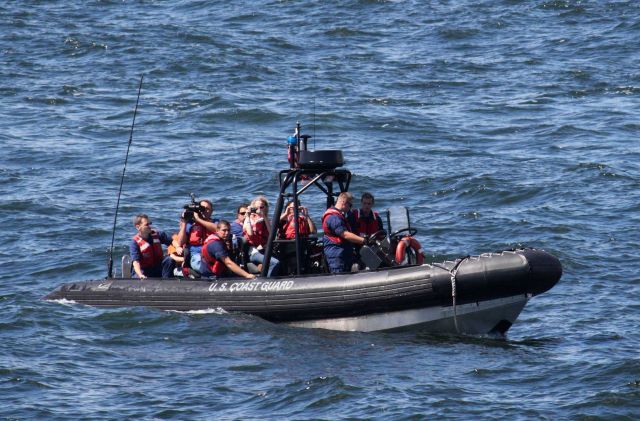 United States Coast Guard rigid-hull inflatable boat preparing to discharge passengers on NOAA Ship PISCES. Picture