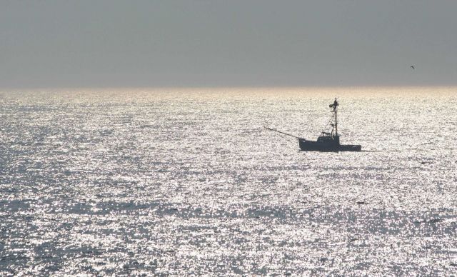 Swordfish boat with lookout in the afternoon sun Picture