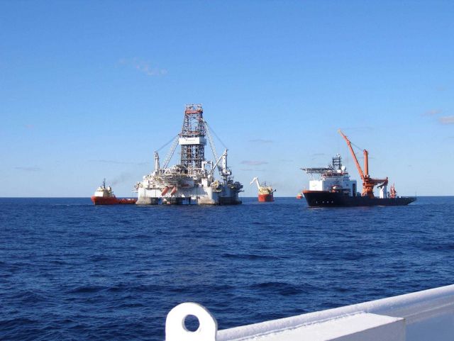 Drill rigs and work vessels on-site at the Deepwater Horizon disaster location. Picture
