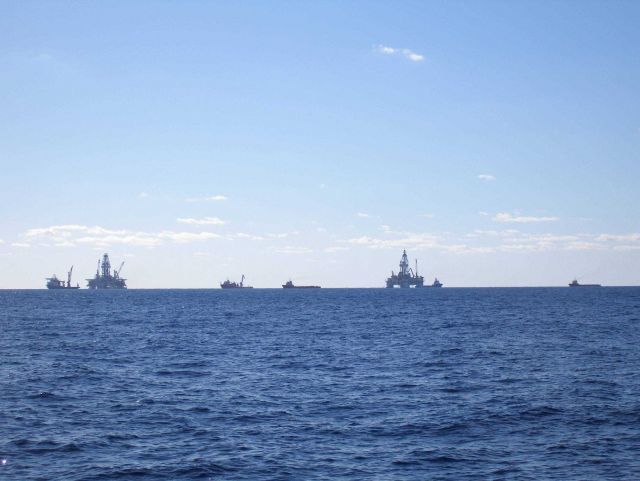 Drill rigs and work vessels on-site at the Deepwater Horizon disaster location. Picture