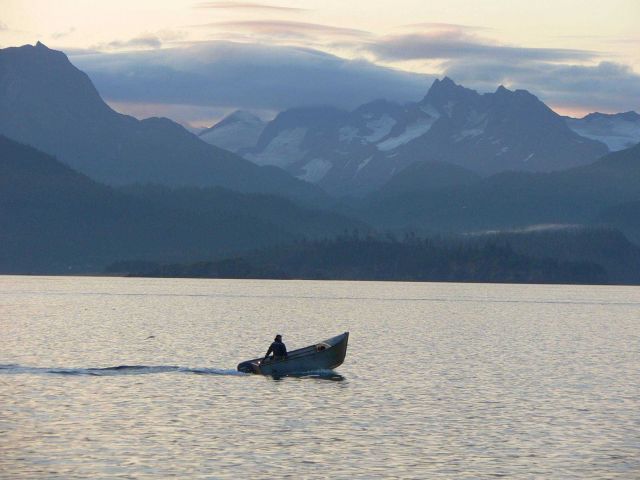 Small skiff with high prow to stem choppy waters. Picture