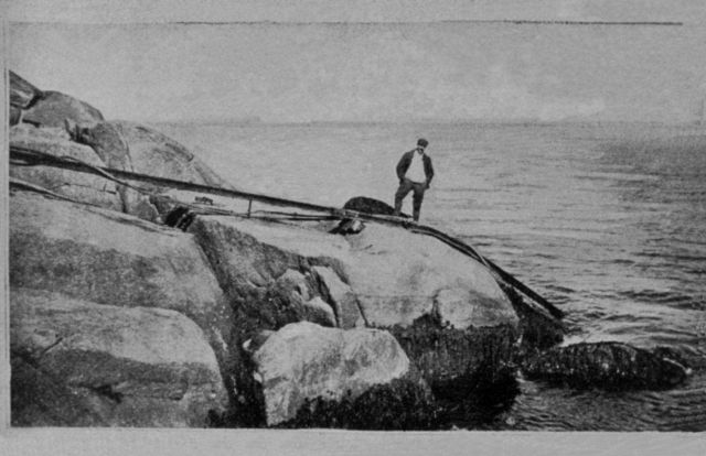 Landing for submarine cable attached to submarine signaling bell buoy. Picture