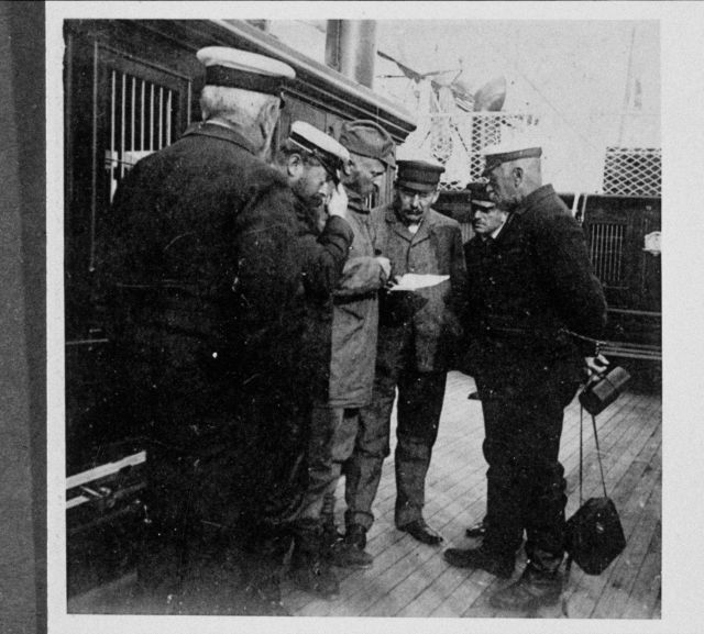Prince Albert I of Monaco and members of the scientific complement conferring with Captain G Picture