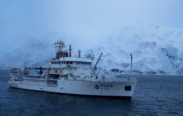 NOAA Ship OSCAR DYSON in an ice encrusted Three Saints Bay. Picture