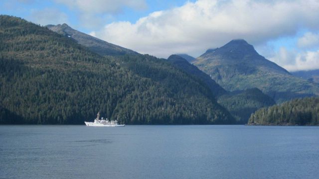 NOAA Ship FAIRWEATHER and the majestic peaks of Chatham Strait area. Picture